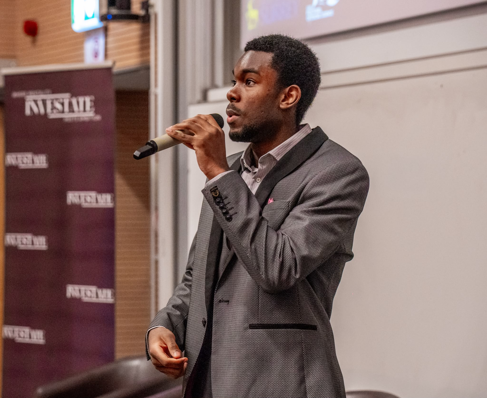 Lenon Muma speaking at an Investate event